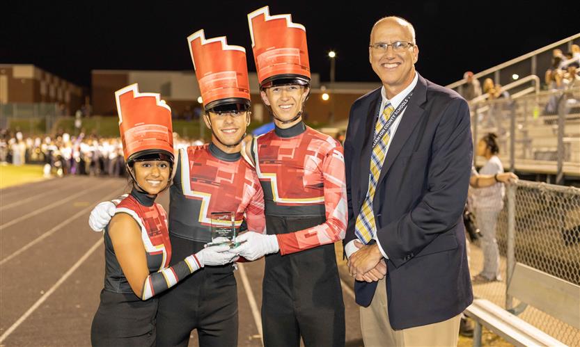 Bands perform on football field